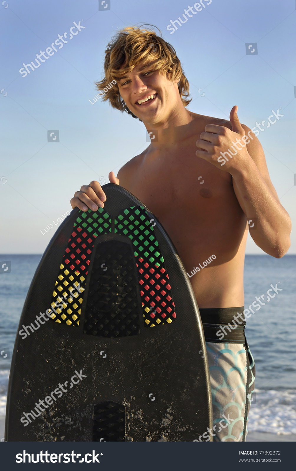 Handsome Surfer Posing In The Beach Stock Photo 77392372 : Shutterstock