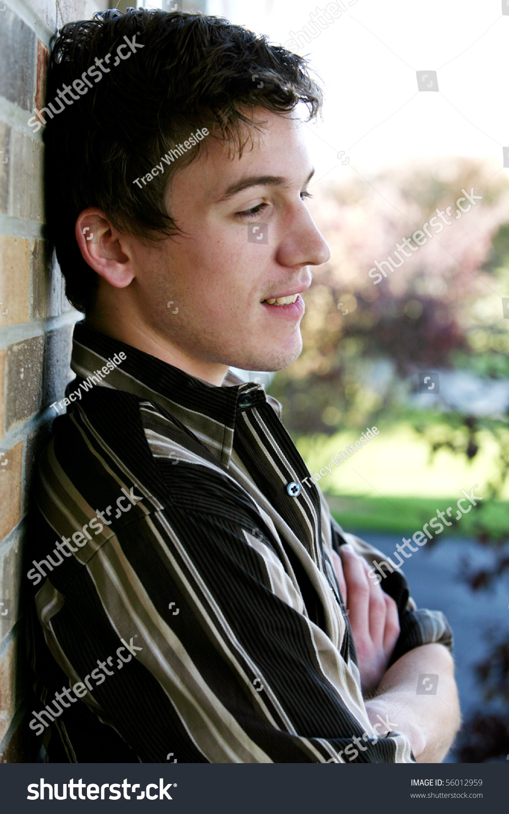 Handsome Teen Boy By Brick Wall Stock Photo 56012959 - Shutterstock
