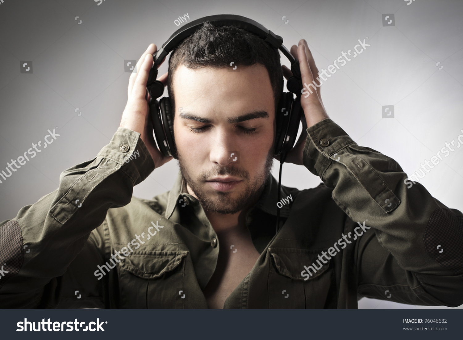 Handsome Young Man Putting On Headphones Stock Photo 96046682