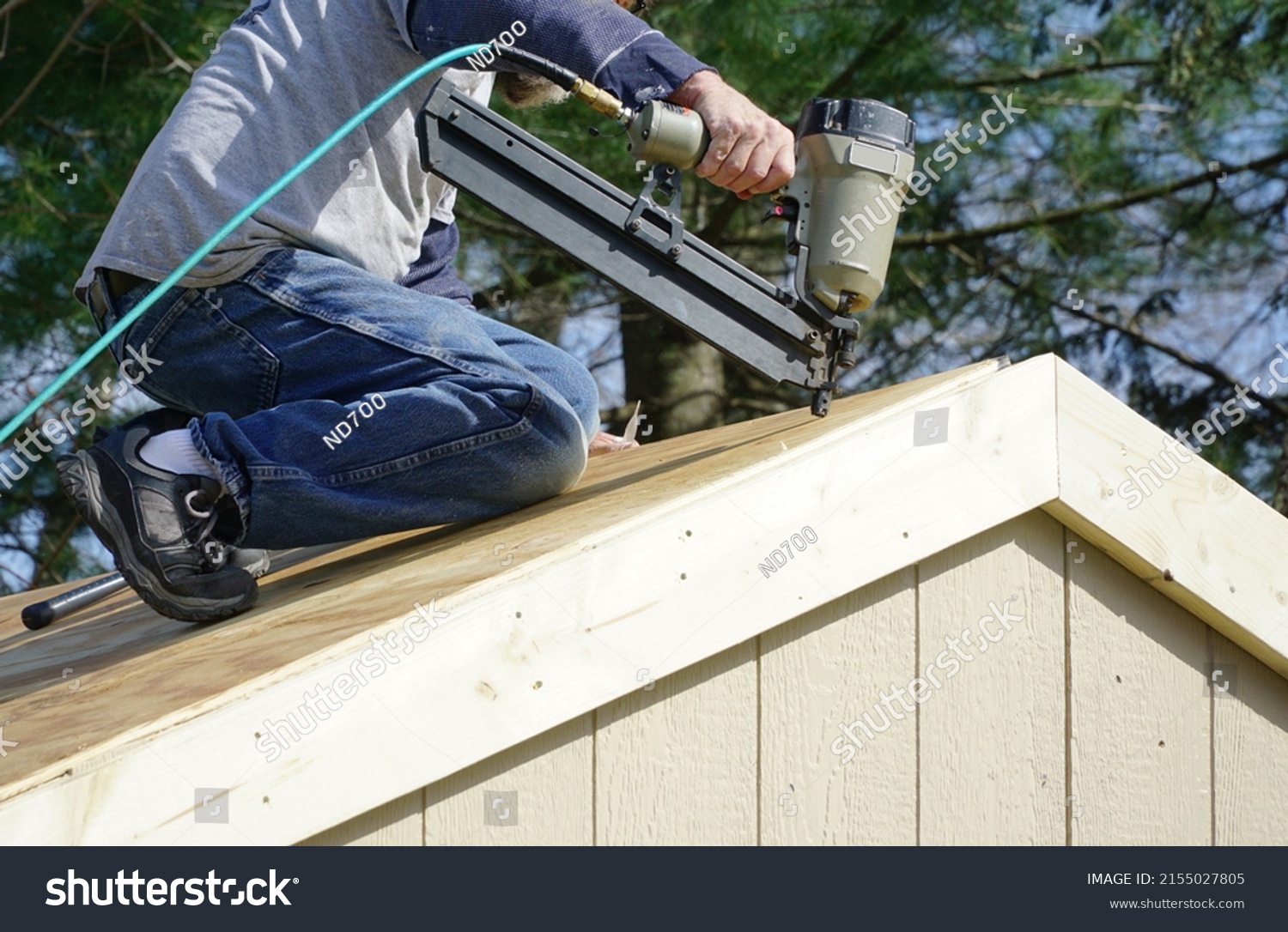 Handyman Using Nail Gun Install Shingle Stock Photo 2155027805 ...