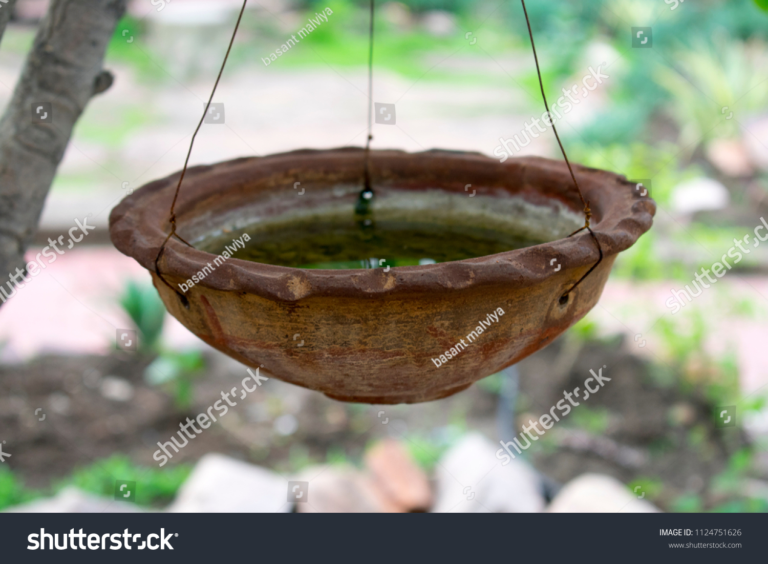 Hanging Clay Pot On Tree Water Stock Photo Edit Now 1124751626