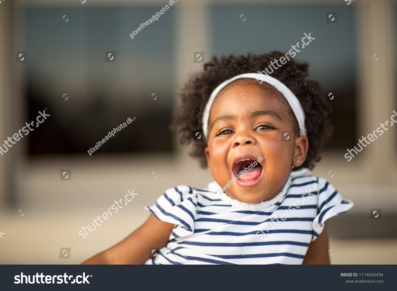 Happy African American Little Girl Laughing Stock Photo 1114926434 ...