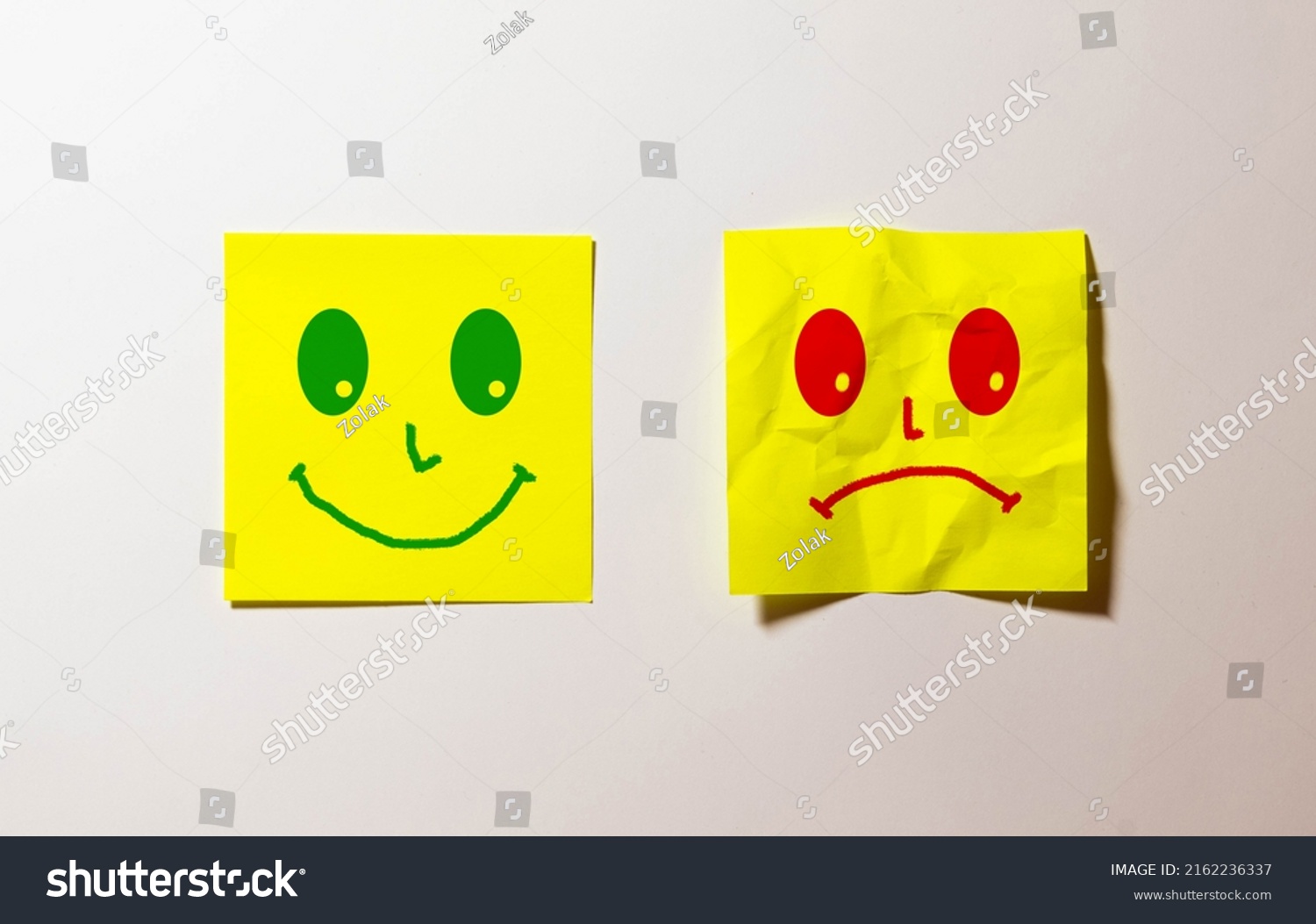 happy-sad-face-emoticons-on-green-stock-photo-2162236337-shutterstock