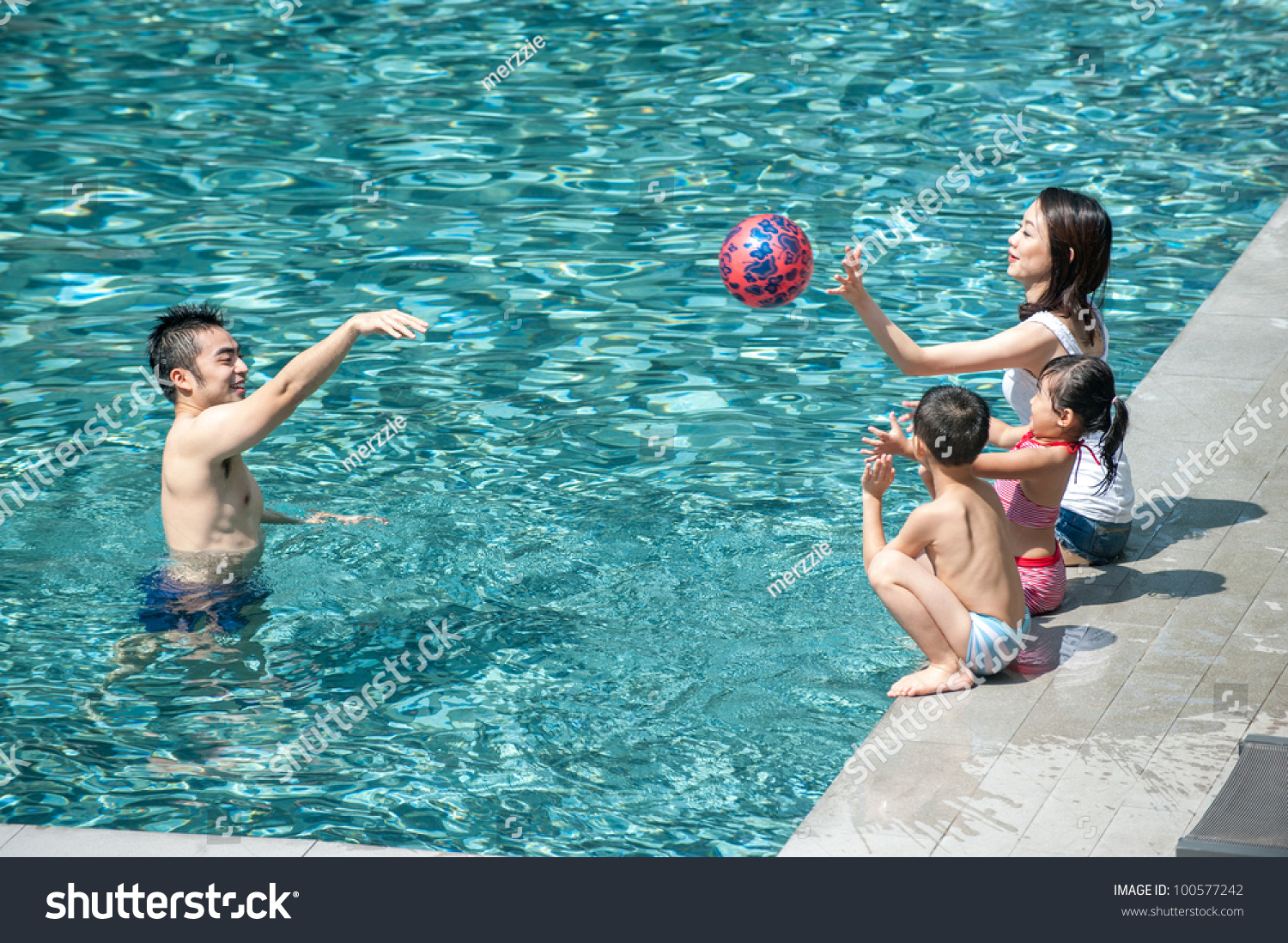 happy-asian-family-playing-pool-nh-c-s-n100577242-shutterstock