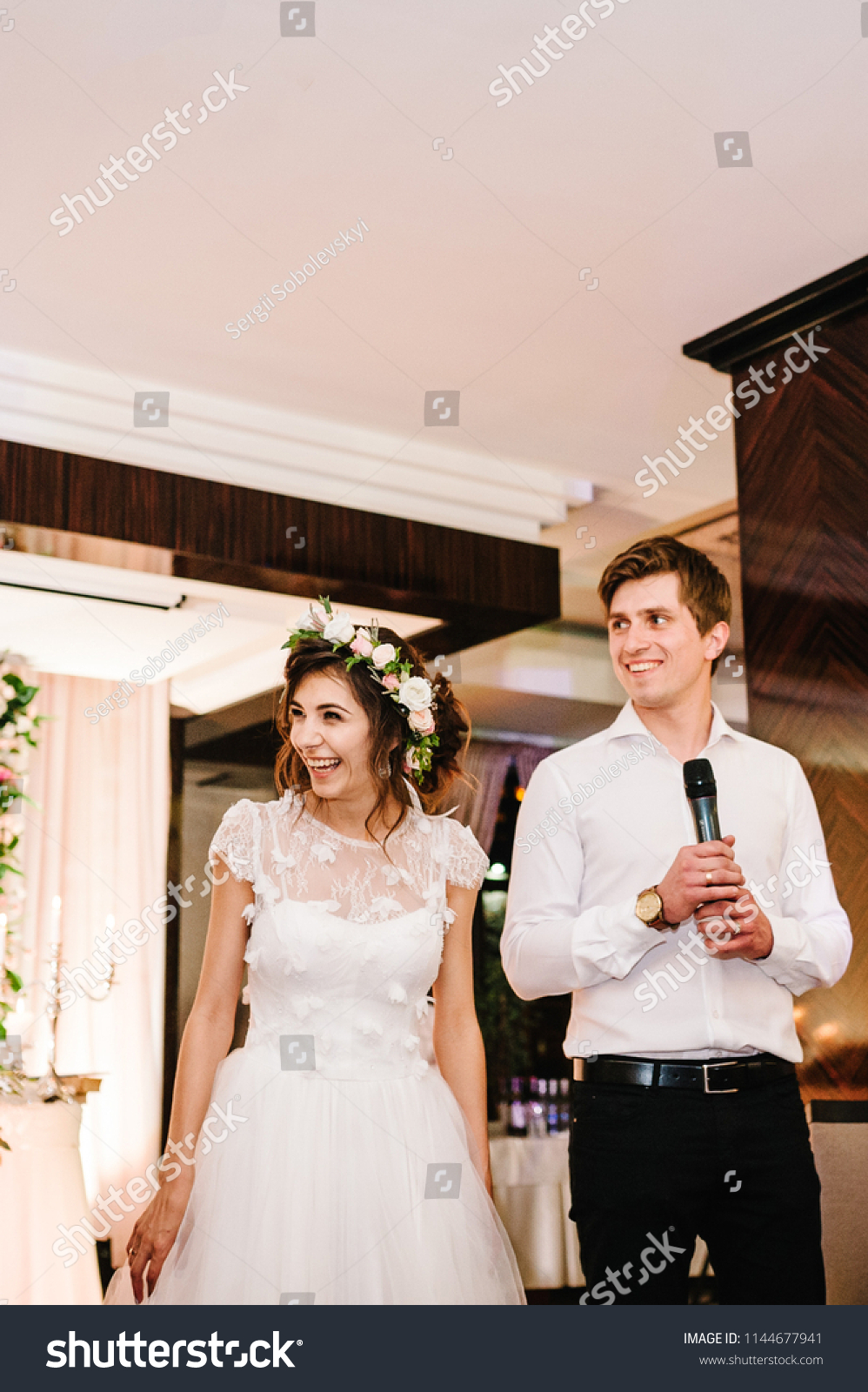 stock photo happy bride and groom talk in a microphone toast to give thanks to their parents for celebrating 1144677941