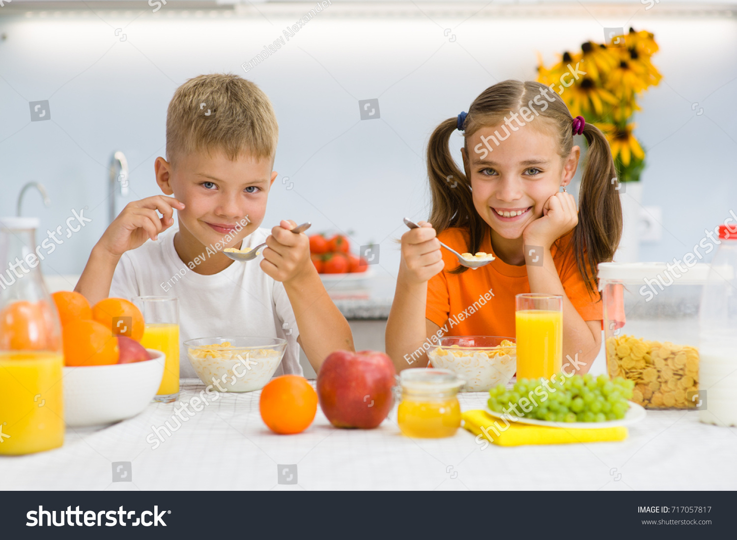 Happy Children Eat Corn Flakes Breakfast Stock Photo (Edit Now) 717057817