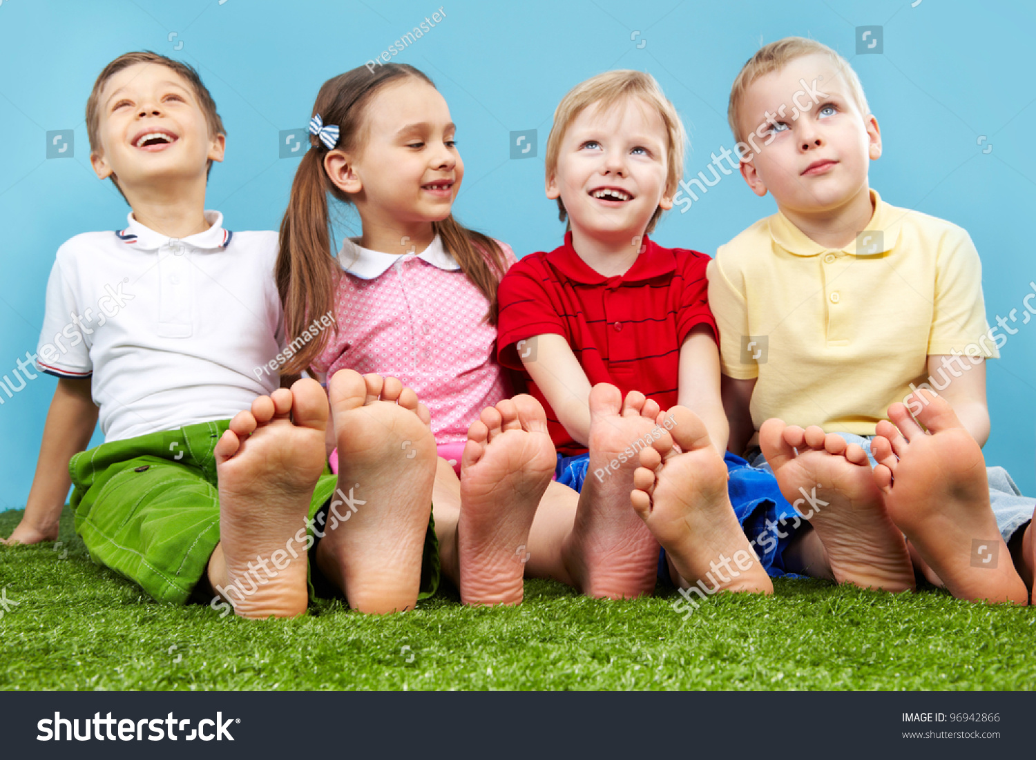 Happy Children Sitting On The Lawn Barefoot Stock Photo 96942866 ...