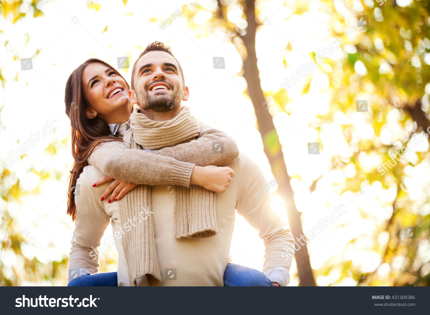 Happy Couple Piggyback Ride At The Park Stock Photo 431309386 