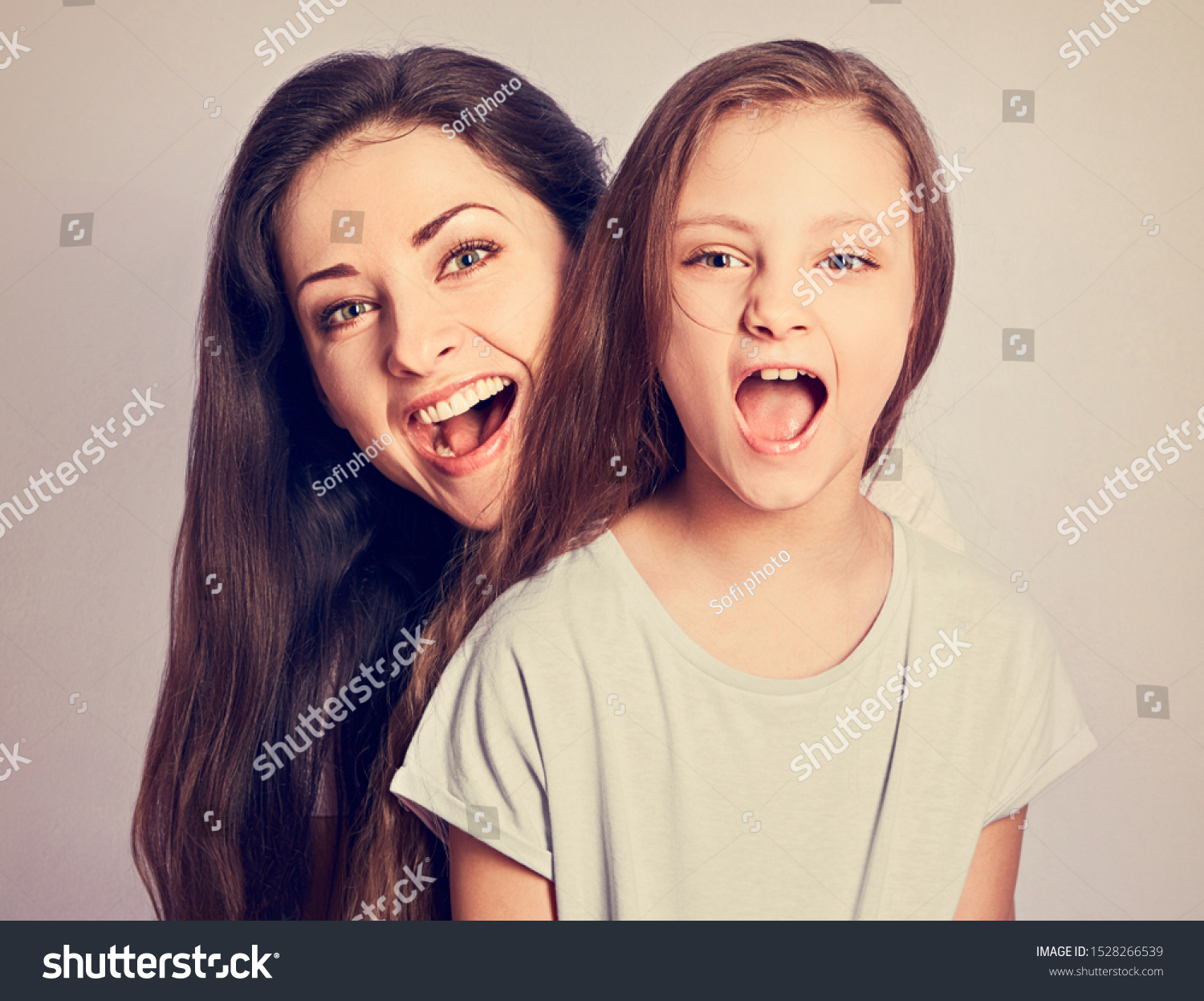 Happy Excited Cuddling Mother Daughter Shouting Stok Fotoğrafı