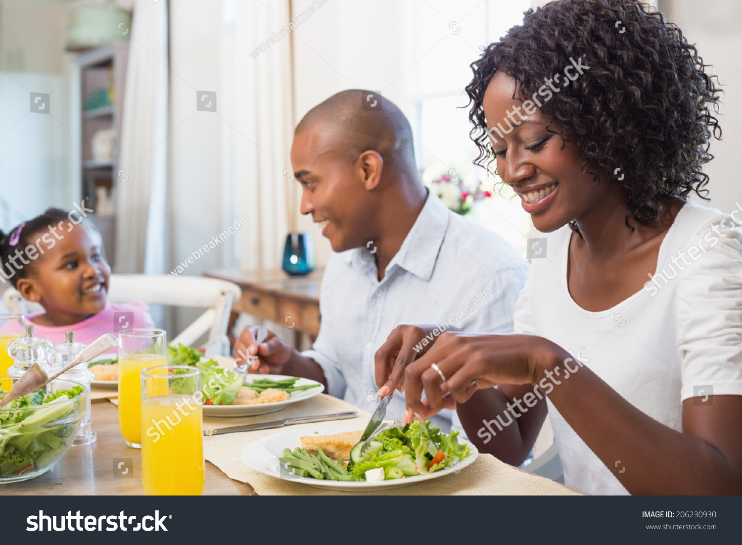 Happy Family Enjoying Healthy Meal Together Stock Photo (Edit Now ...