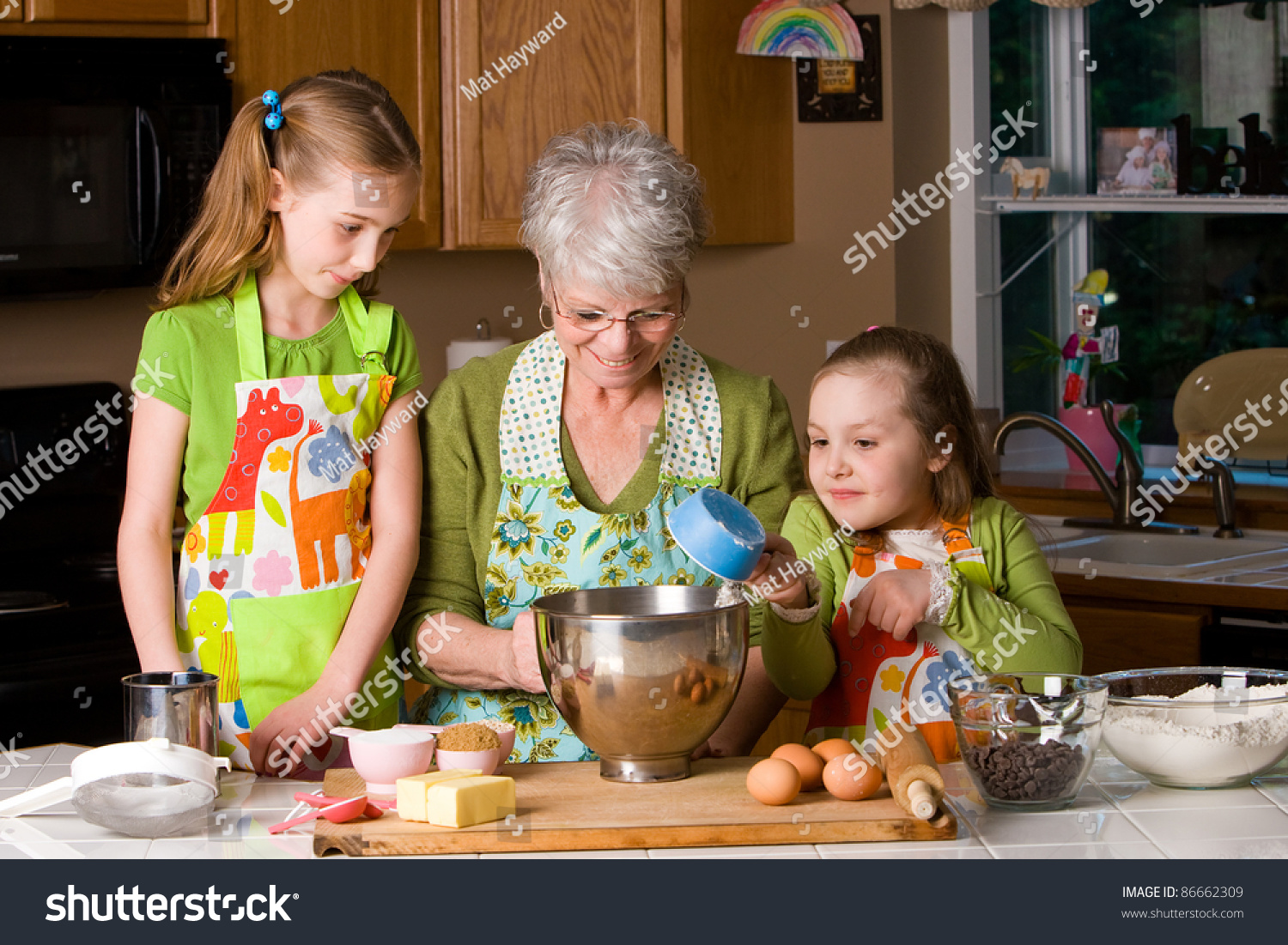 Happy Family Featuring A Friendly Grandma Baking Cookies In A Home ...