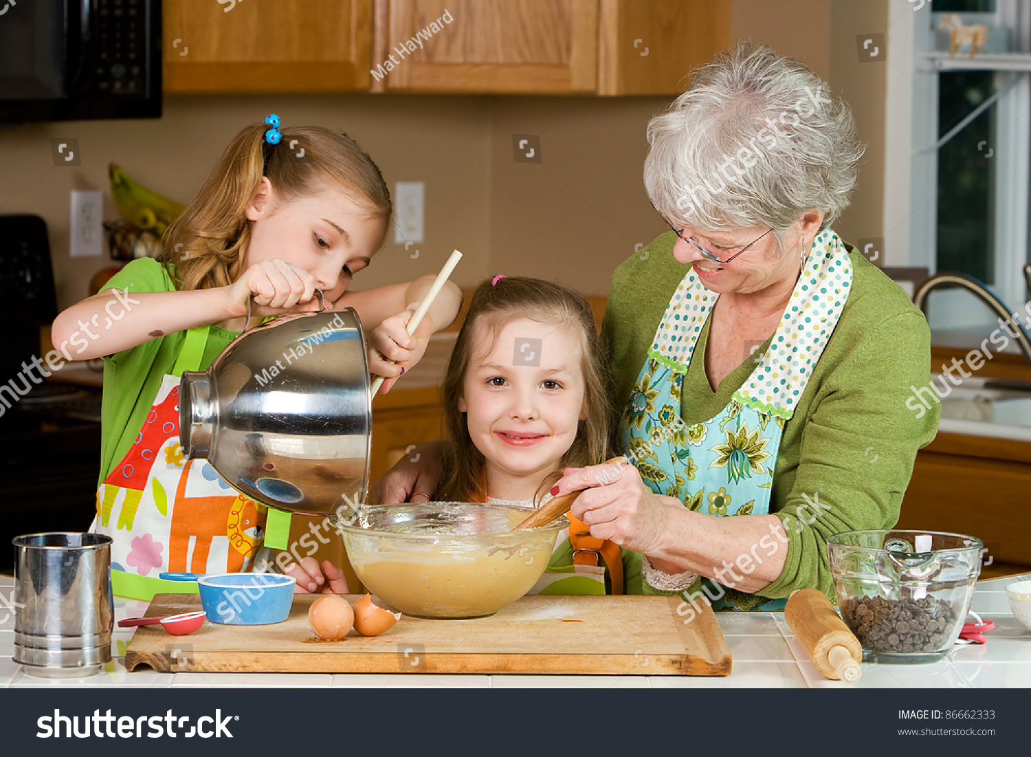 Happy Family Featuring A Friendly Grandma Baking Cookies In A Home ...