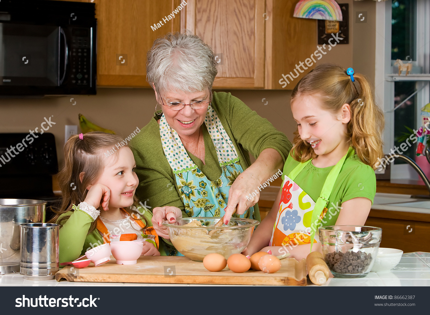 Happy Family Featuring A Friendly Grandma Baking Cookies In A Home ...