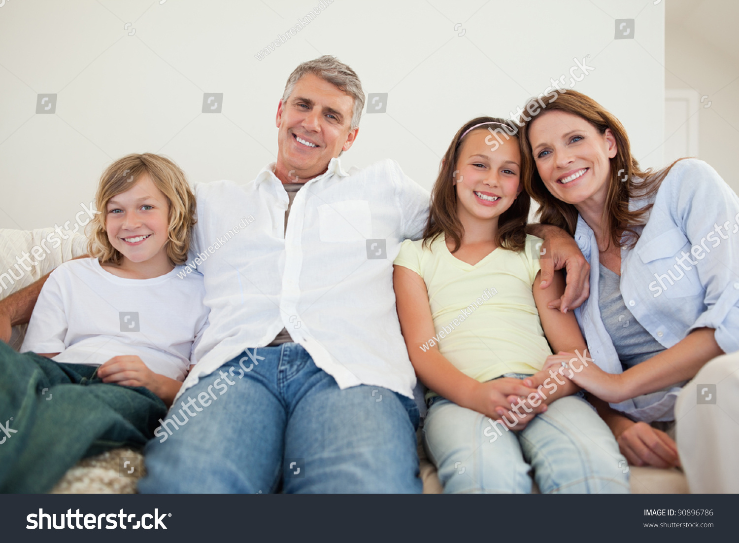 Happy Family Sitting On The Sofa Together Stock Photo 90896786 ...