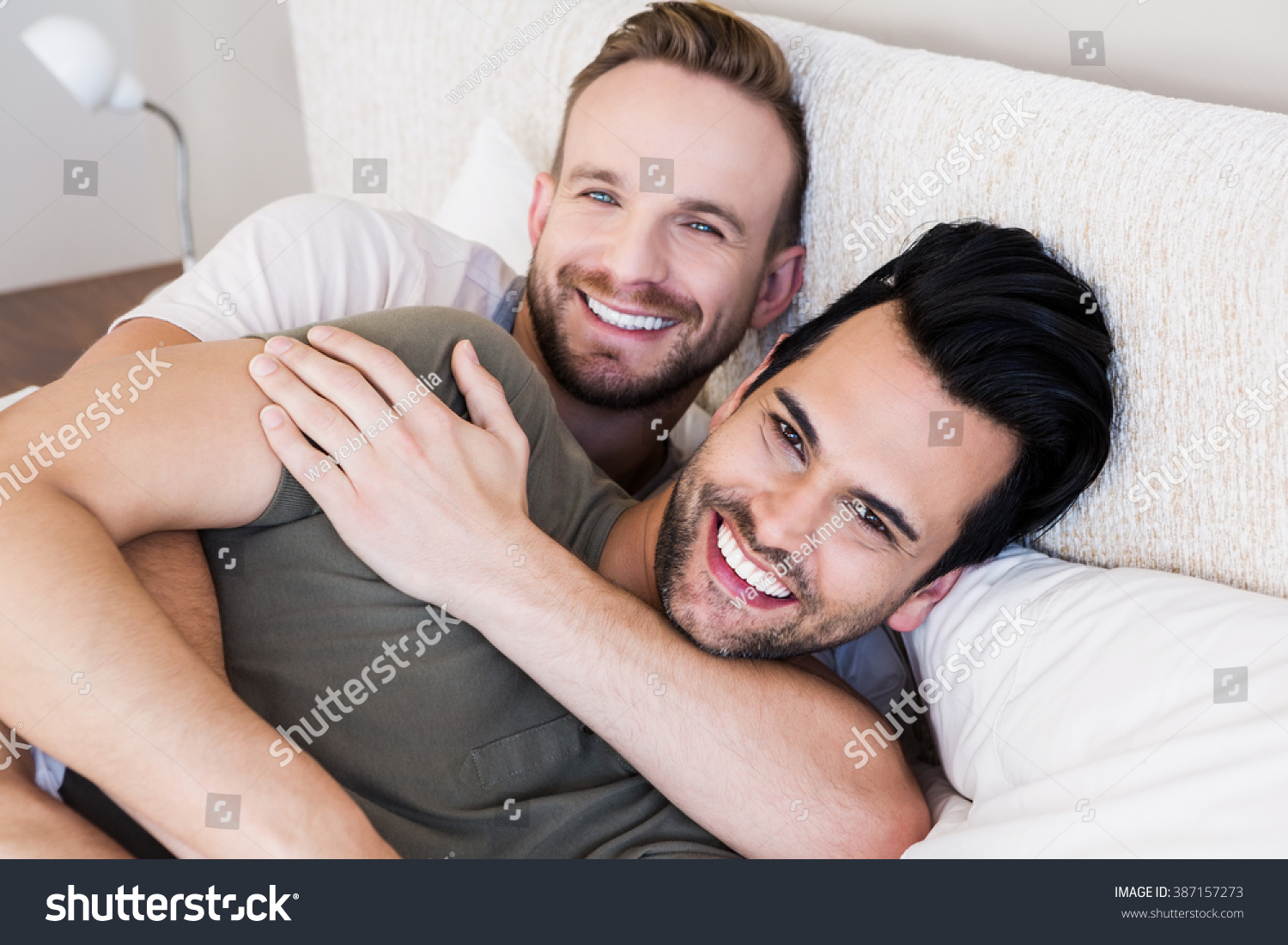 Happy Gay Couple Lying On Bed At Home Foto Stock 387157273 Shutterstock 