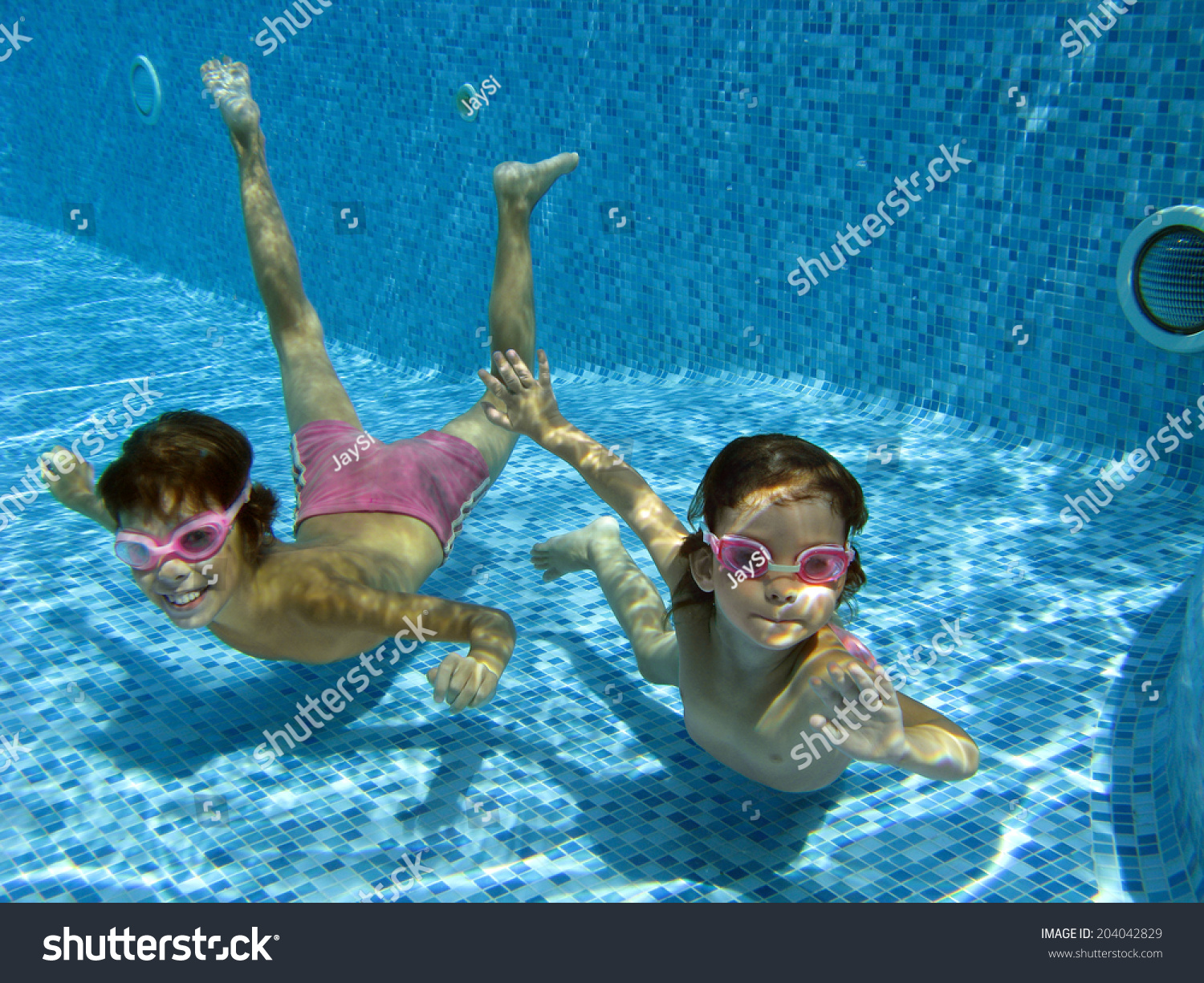 happy kids swim underwater in pool and having fun children on summer vacation sport - Kids Swimming Underwater happy kids swim underwater in pool and having fun children on summer vacation sport - Kids Swimming Underwater