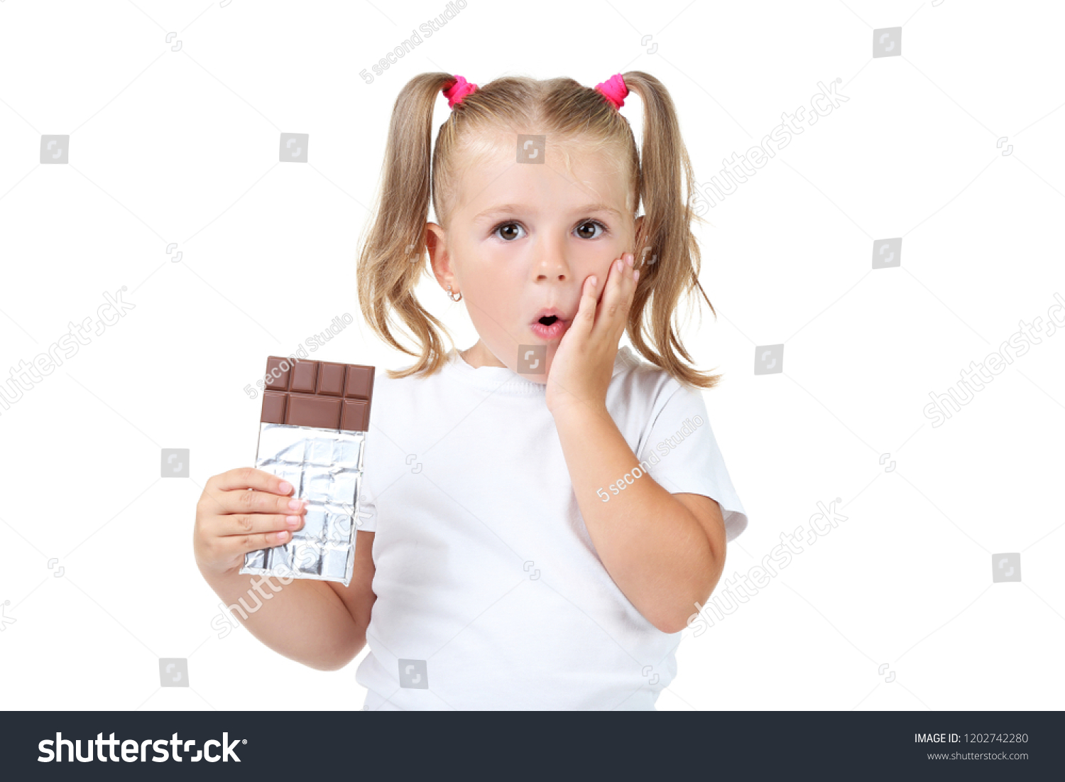 Happy Little Girl Eating Chocolate On Stock Photo (Edit Now) 1202742280