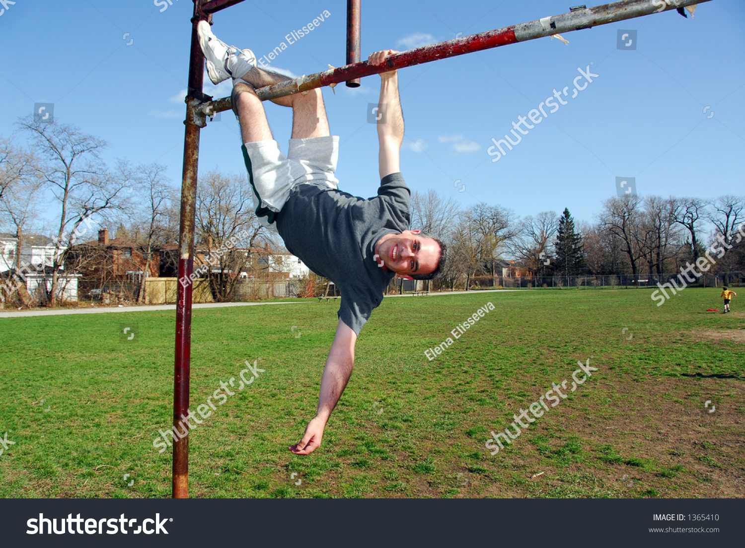 Happy Man Hanging Upside Down From A Soccer Gate Stock Photo 1365410 ...
