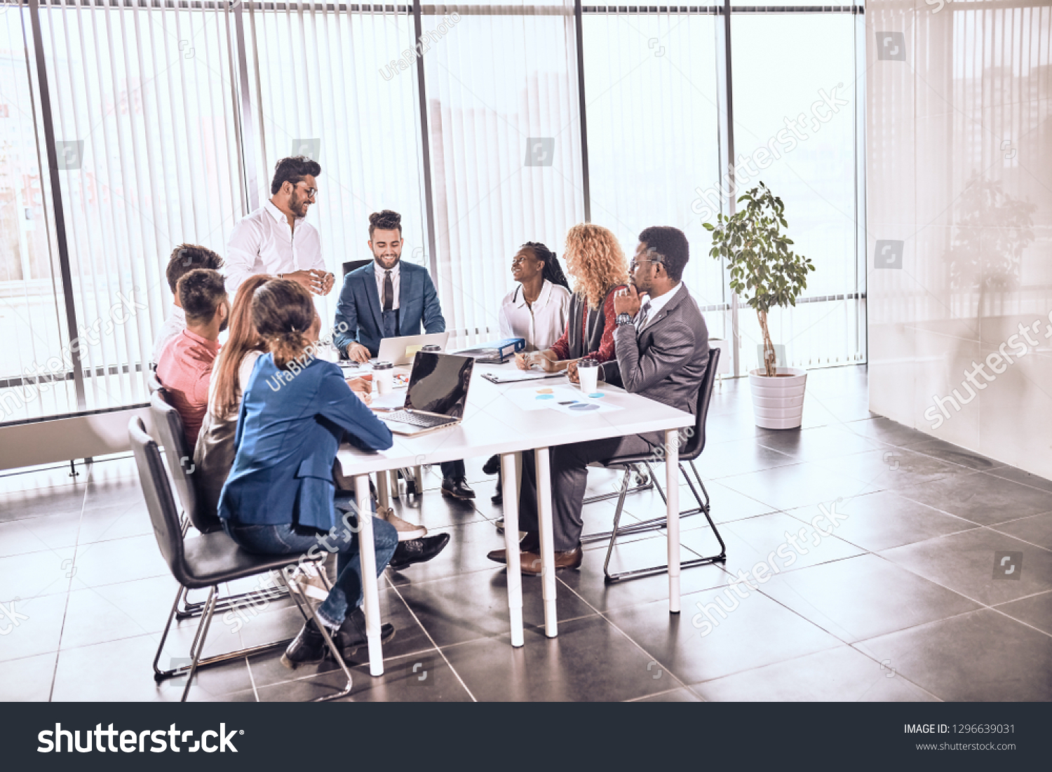 Happy Office Workers Gathered Conference Room Foto stock 1296639031