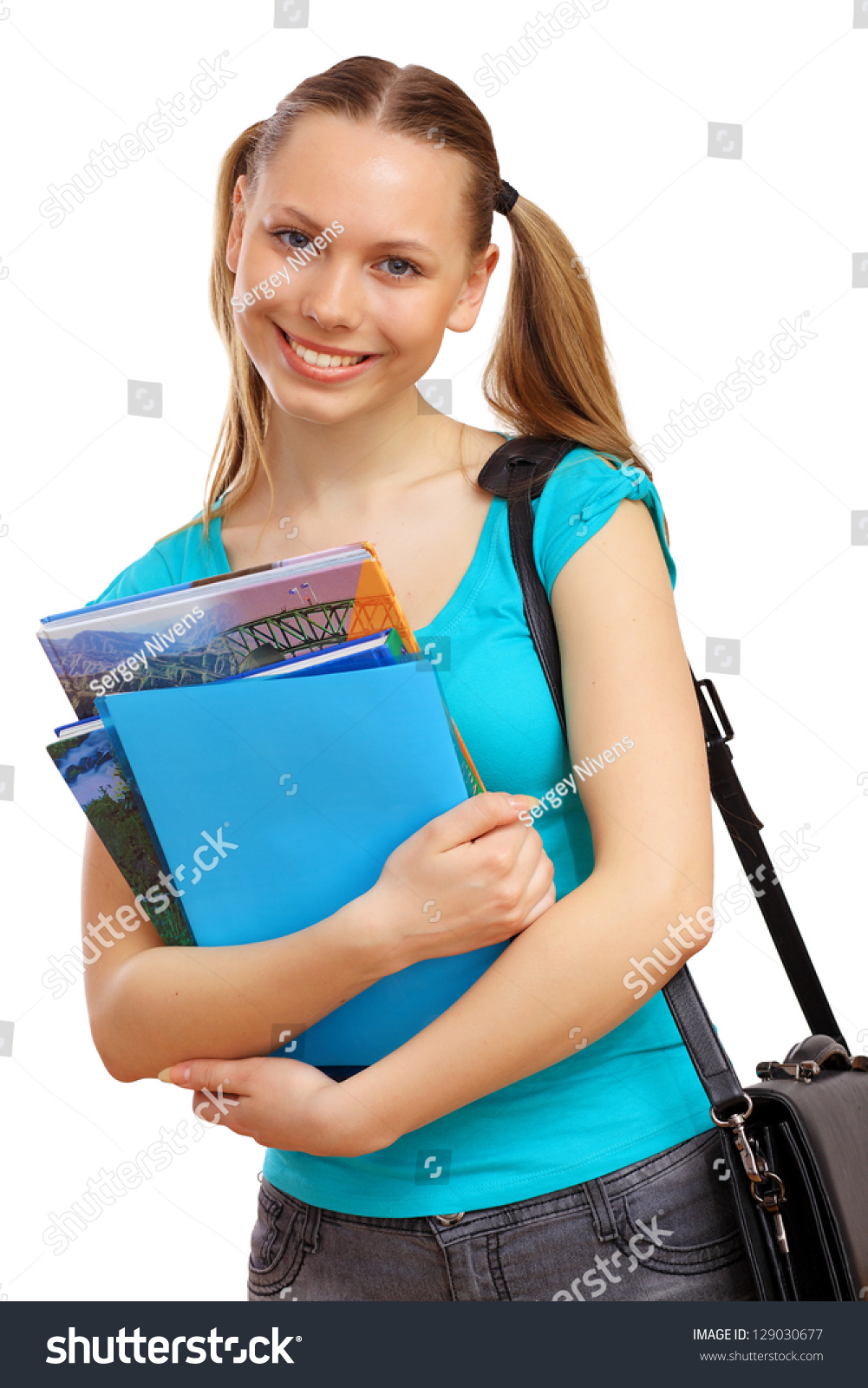 Happy Smiling Student Standing And Holding Books Stock Photo 129030677 ...