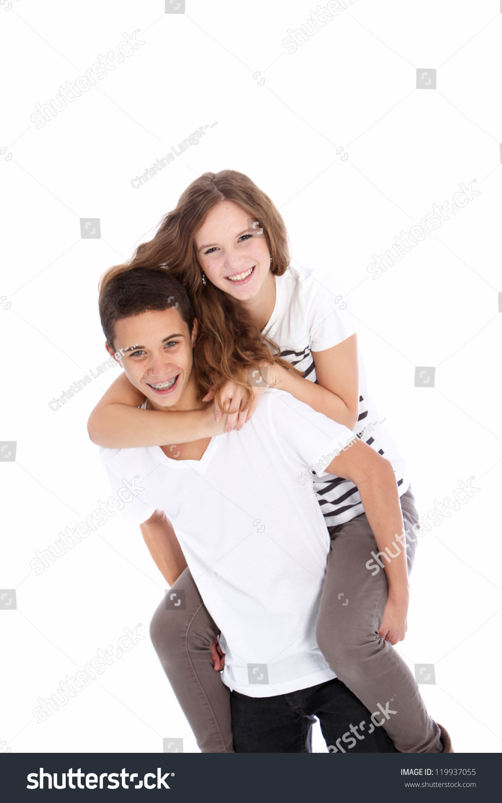 Happy Teenagers Riding Piggyback With The Laughing Girl Astride The ...