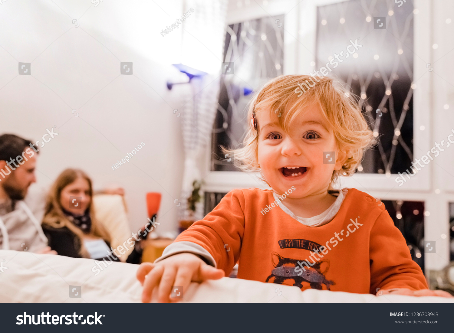 Happy Toddler Girl Parents On Sofa Stock Photo Edit Now