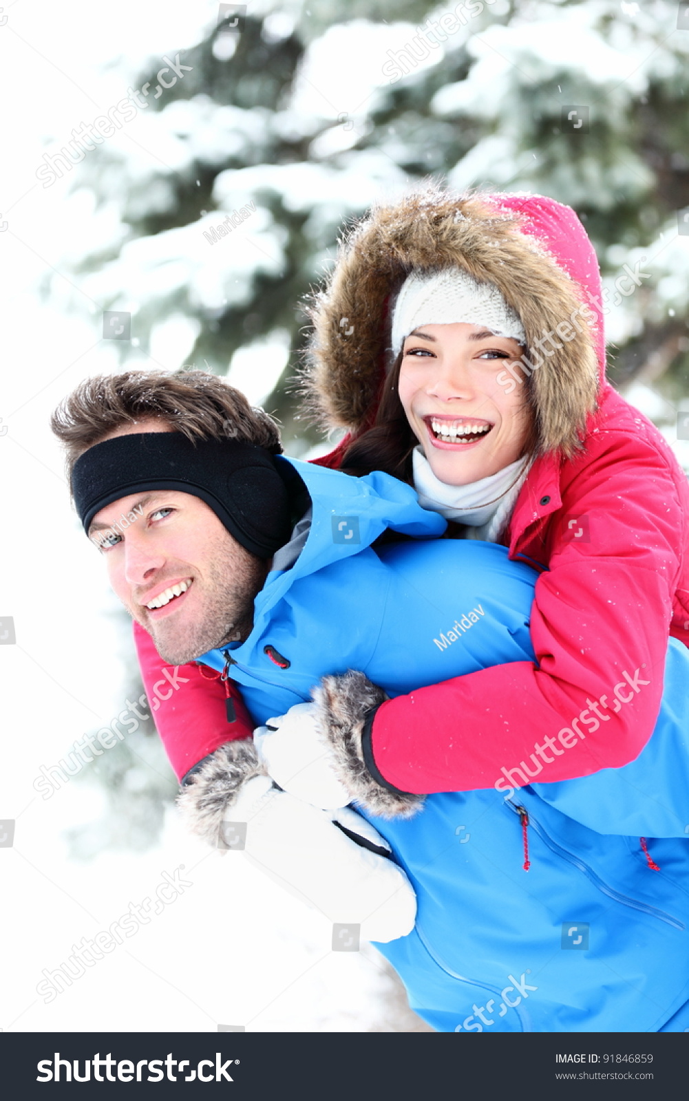 http://image.shutterstock.com/z/stock-photo-happy-winter-couple-piggybacking-in-snow-smiling-and-joyful-at-camera-beautiful-young-multi-ethnic-91846859.jpg