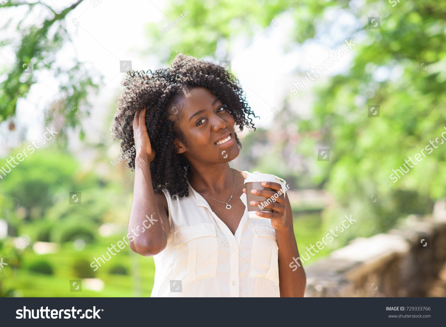 Happy Woman Drinking Coffee Tousling Hair Stock Photo Edit Now