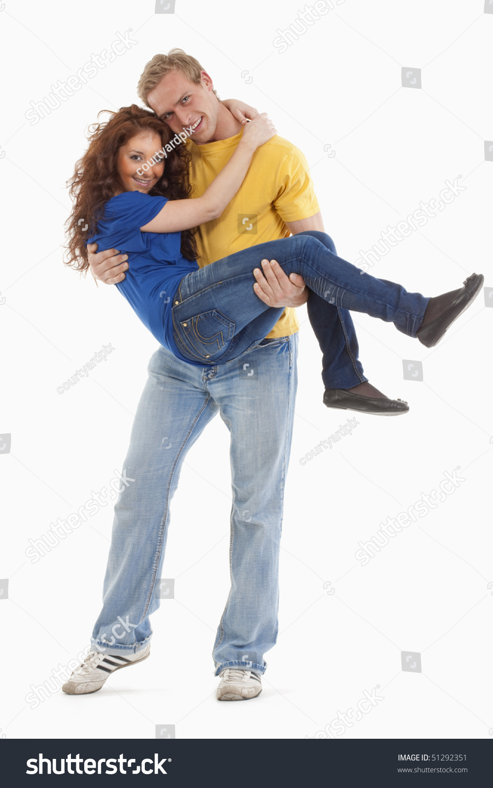 Happy Young Couple Boy Carrying Girl 