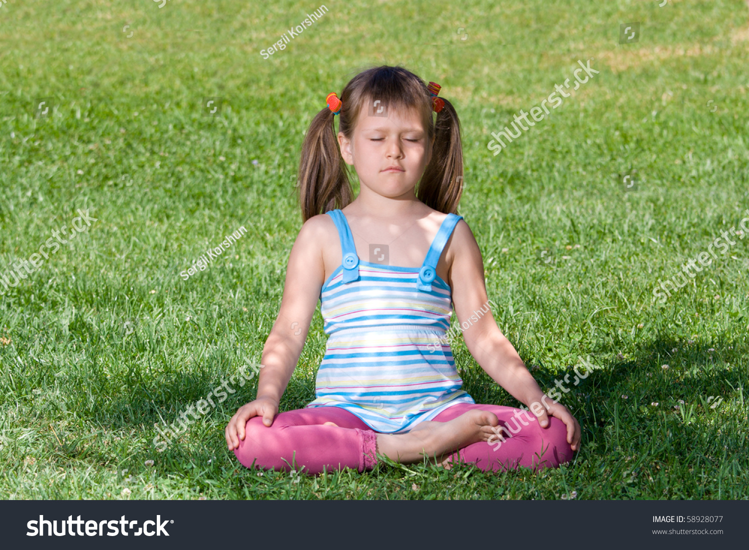 Healthy Lifestyle. Little Cute Girl Who Is Sitting And Meditating In ...