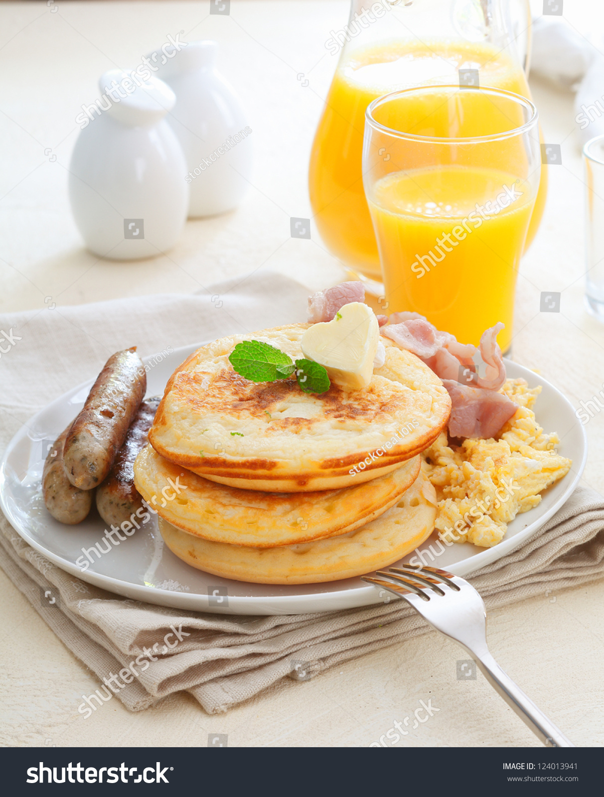 Healthy Nutritious Breakfast With Sausages, Eggs , Bacon And A Stack Of ...
