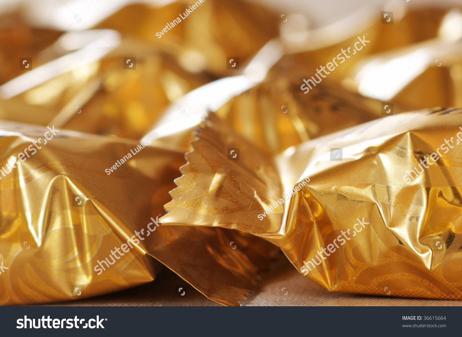 Heap Of Candy Wrapped In Gold Foil. Stock Photo 36615664 : Shutterstock