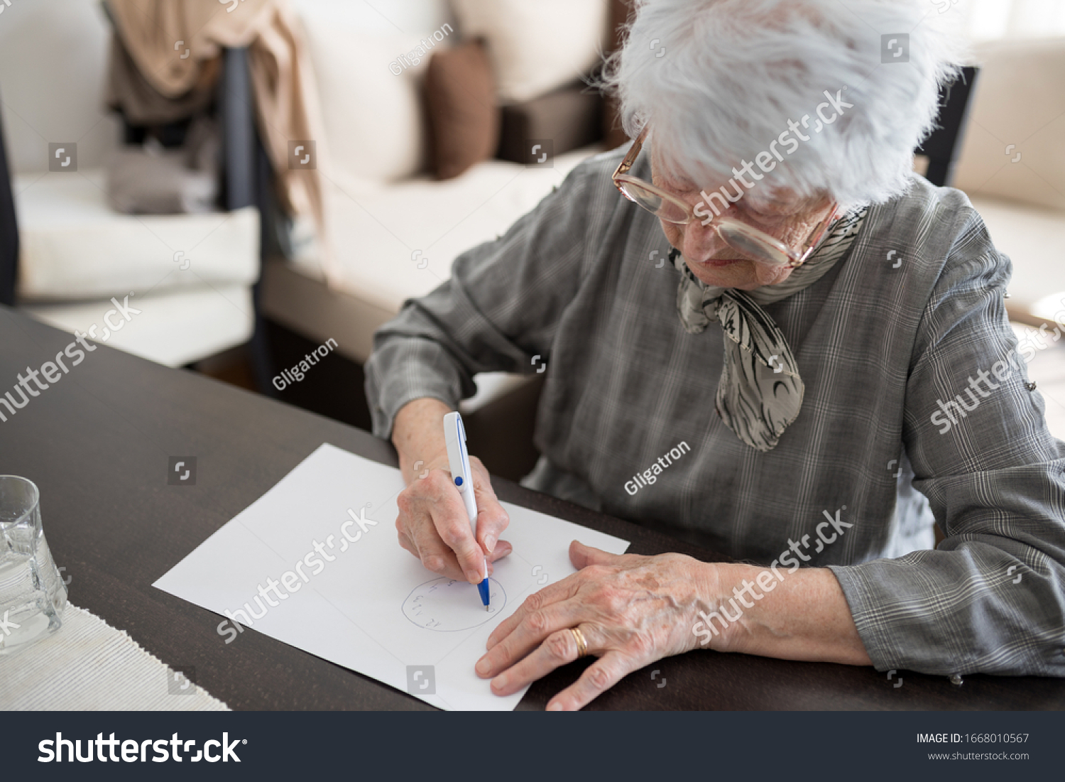 Stock Photo High Angle View Of A Senior Caucasian Woman Doing Alzheimer S Disease Cognitive Functions Clock 1668010567 