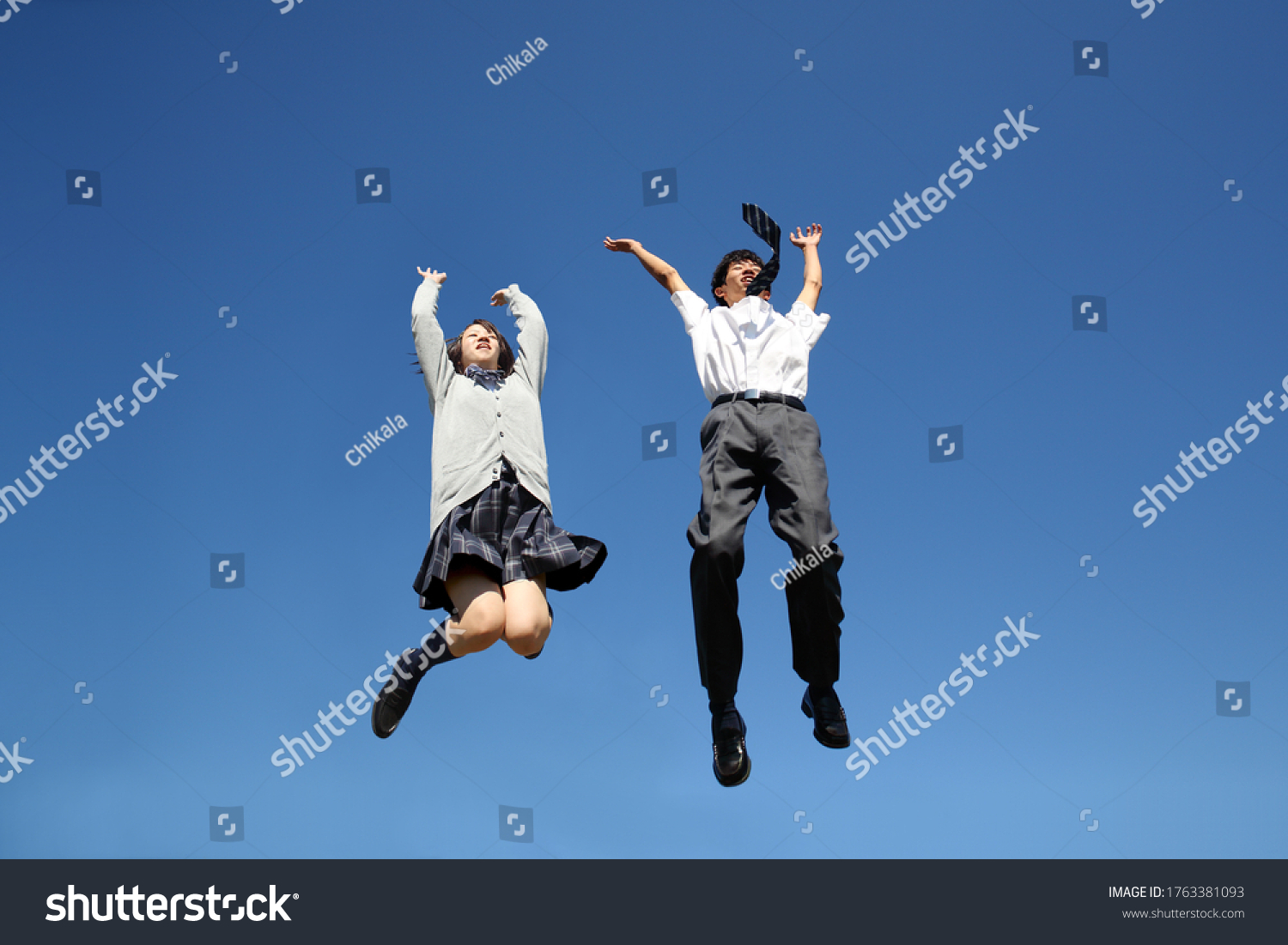 High School Boy Girl Jumping Against Stock Photo 1763381093 | Shutterstock