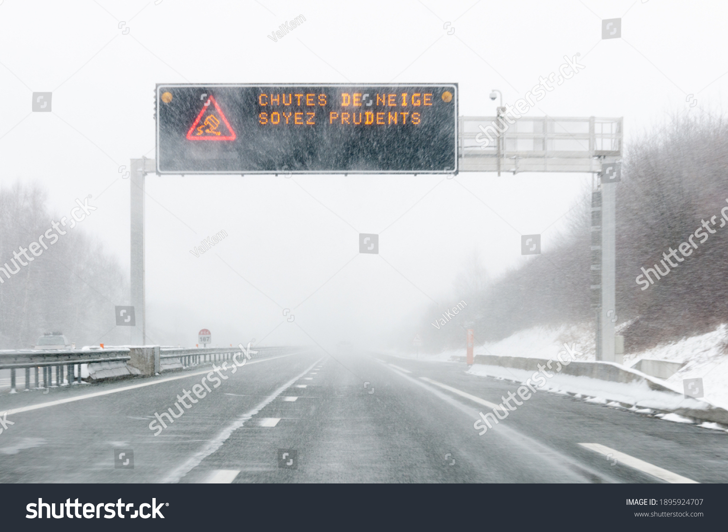 highway-billboard-meaning-be-careful-snowfall-stock-photo-edit-now