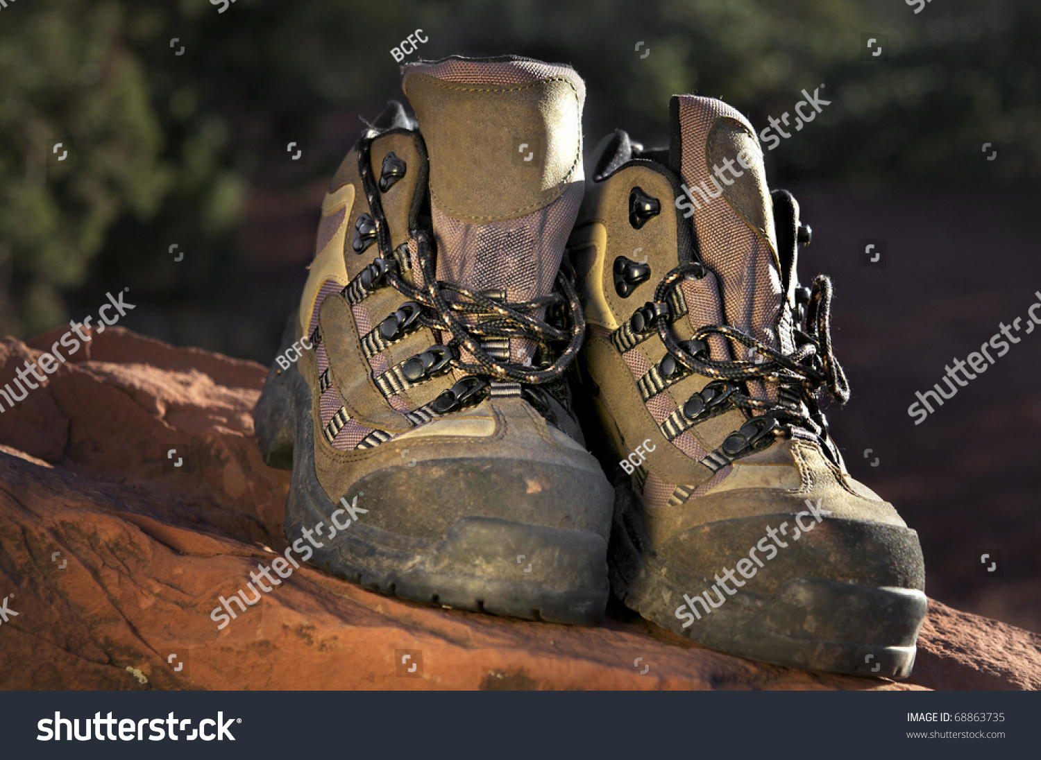 Hiking Boots On Red Rock Stock Photo 