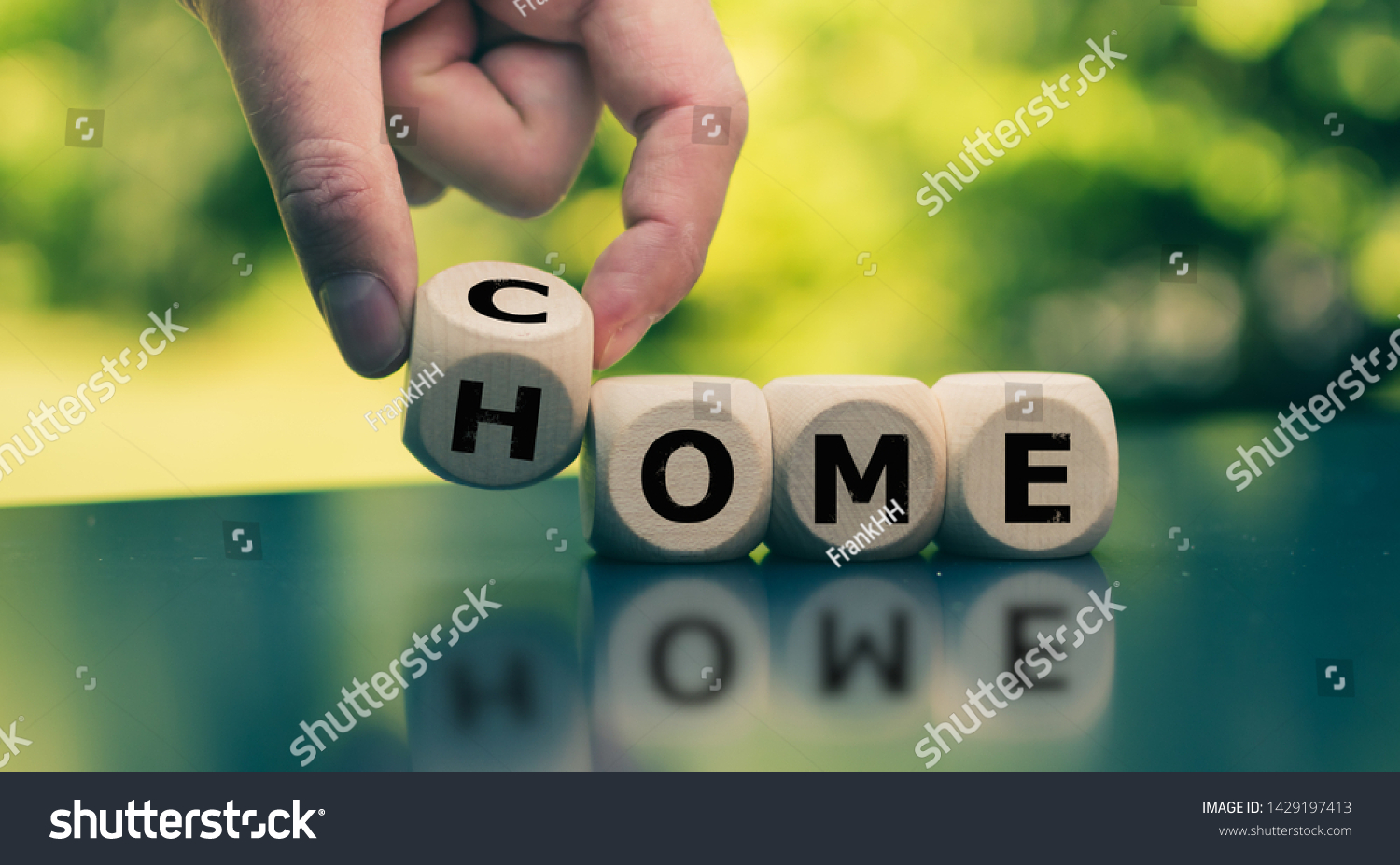 homecoming-concept-hand-turns-cube-changes-stock-photo-1429197413