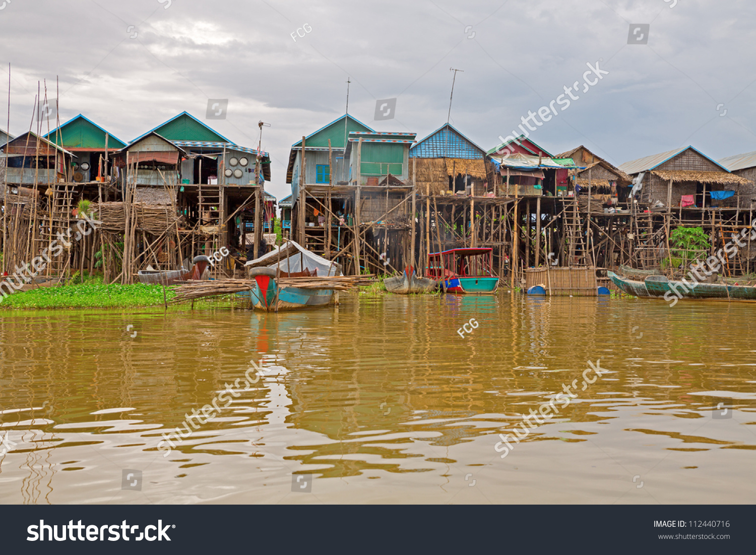 Homes On Stilts On The Floating Village Of Kampong Phluk, Tonle Sap ...