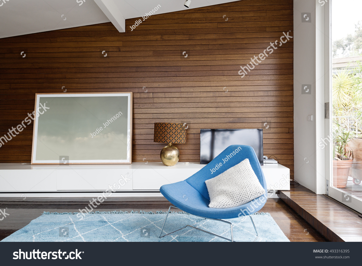 Horizontal Wood Panelling Blue Occasional Chair Stock Image