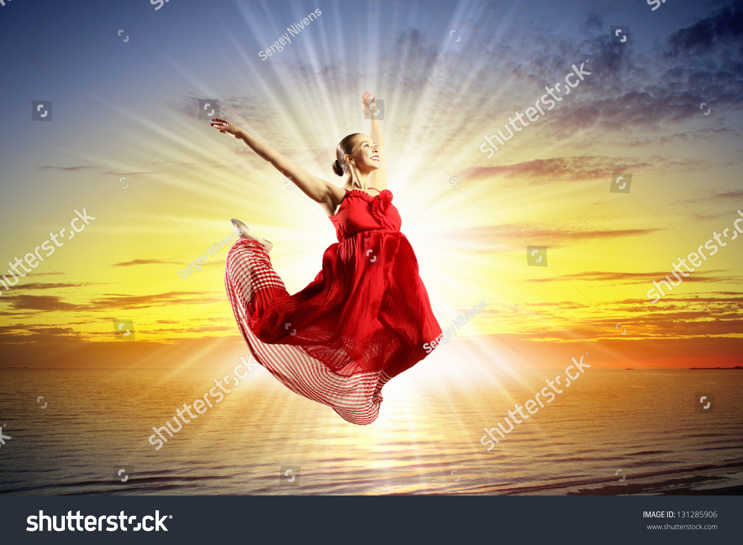 Image Of Female Ballet Dancer Against Sunset Background Soaring Above ...