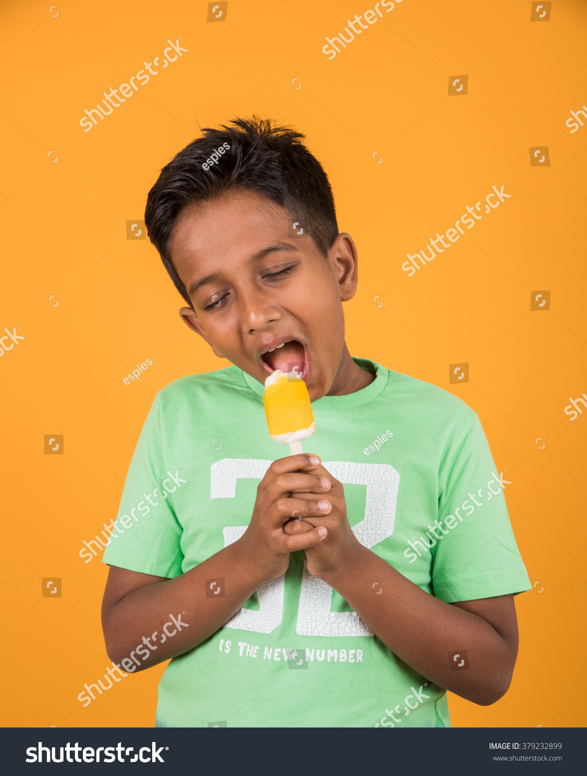 Indianasian Cute Little Boy Eating Ice Stock Photo Edit Now