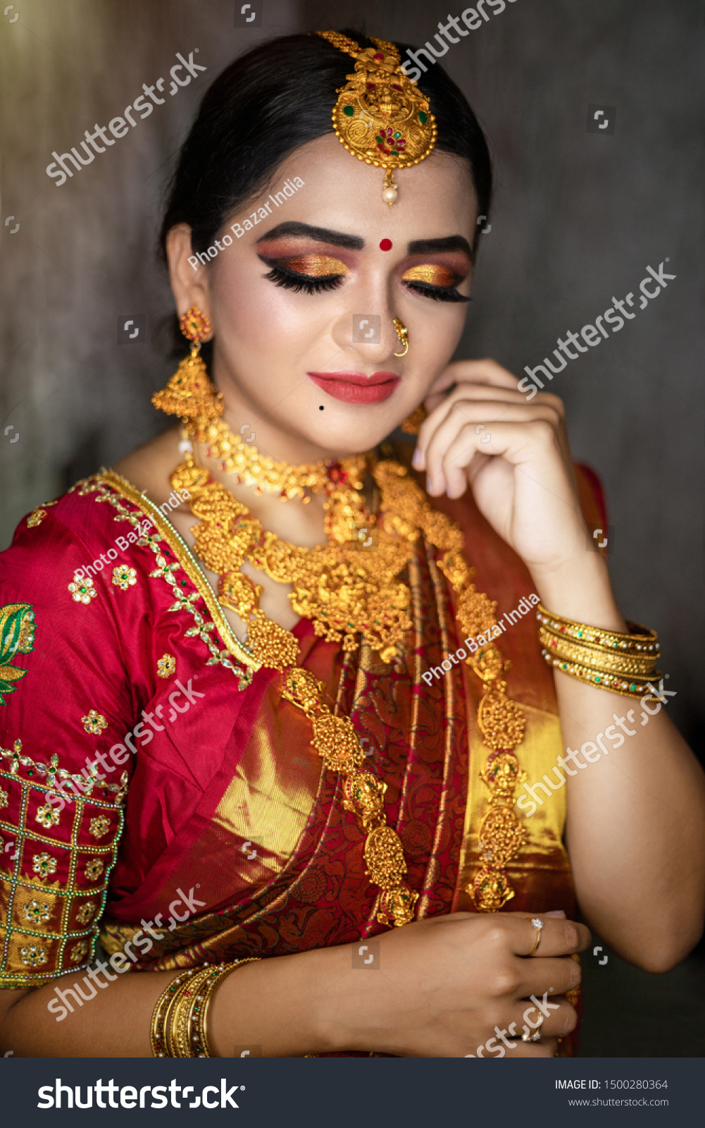 Indian Bride Wearing Heavy Gold Jewelry 