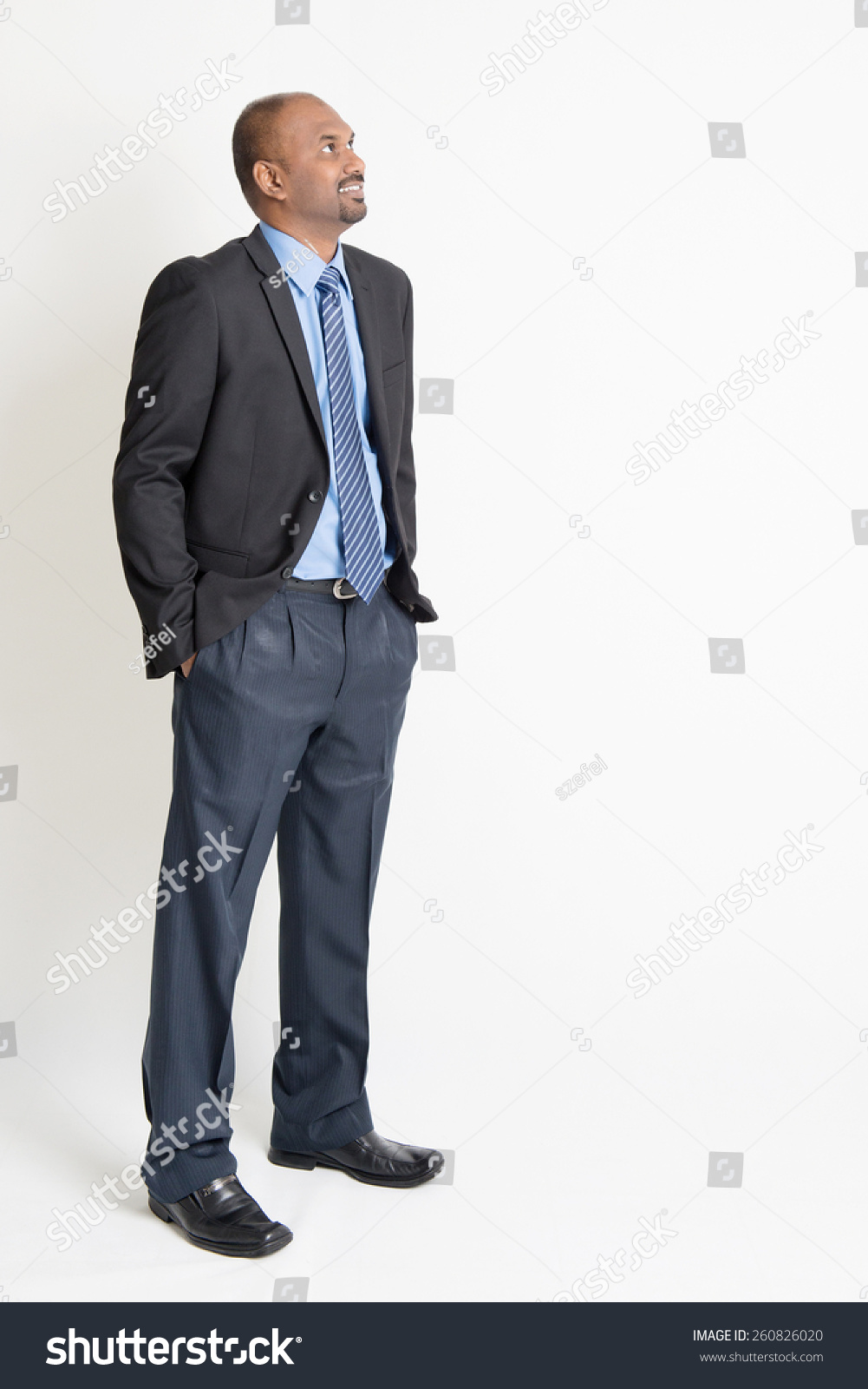 Indian Businessman Smiling And Looking Away Towards Copy Space, Full ...
