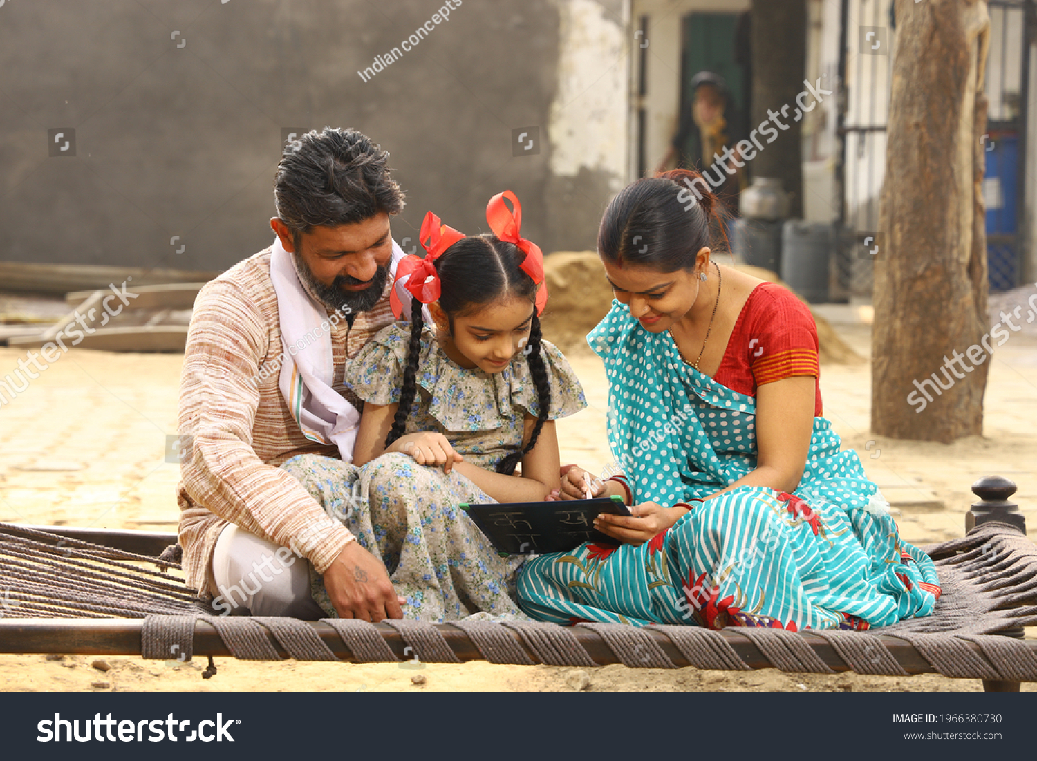 Indian Happy Family Studying Daughter Stock Photo (Edit Now) 1966380730 ...