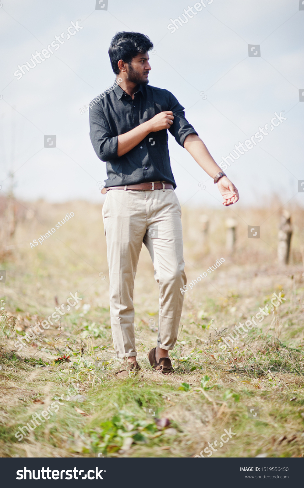 shirt on beige pants