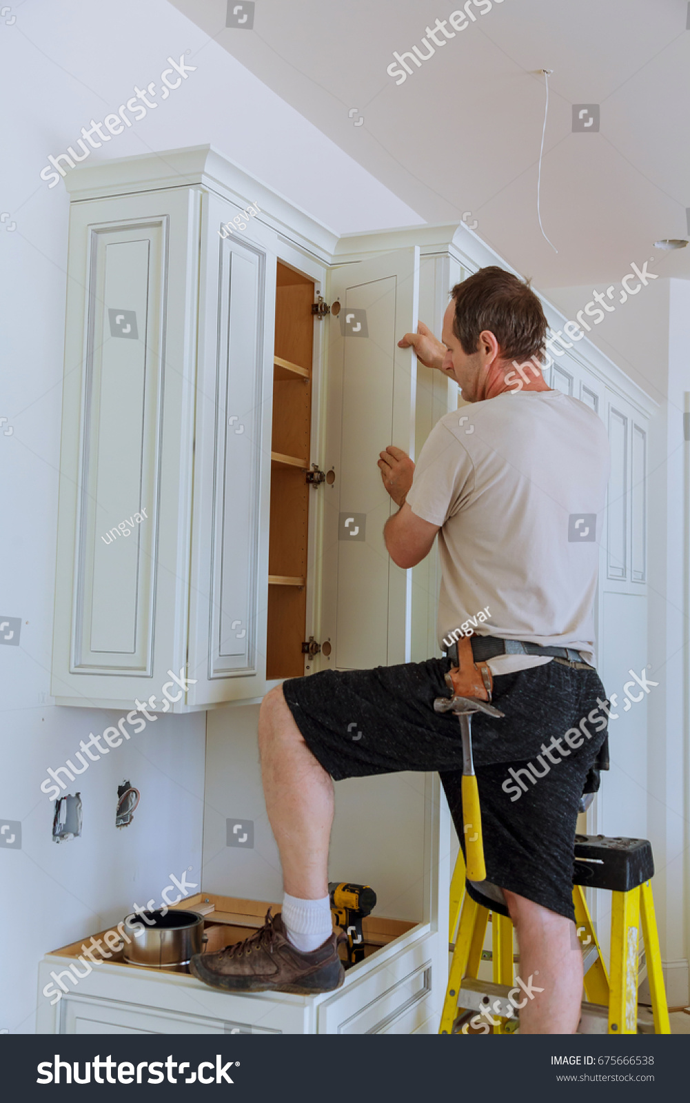 Installation Kitchen Worker Installs Doors Kitchen Stock Photo Edit Now 675666538