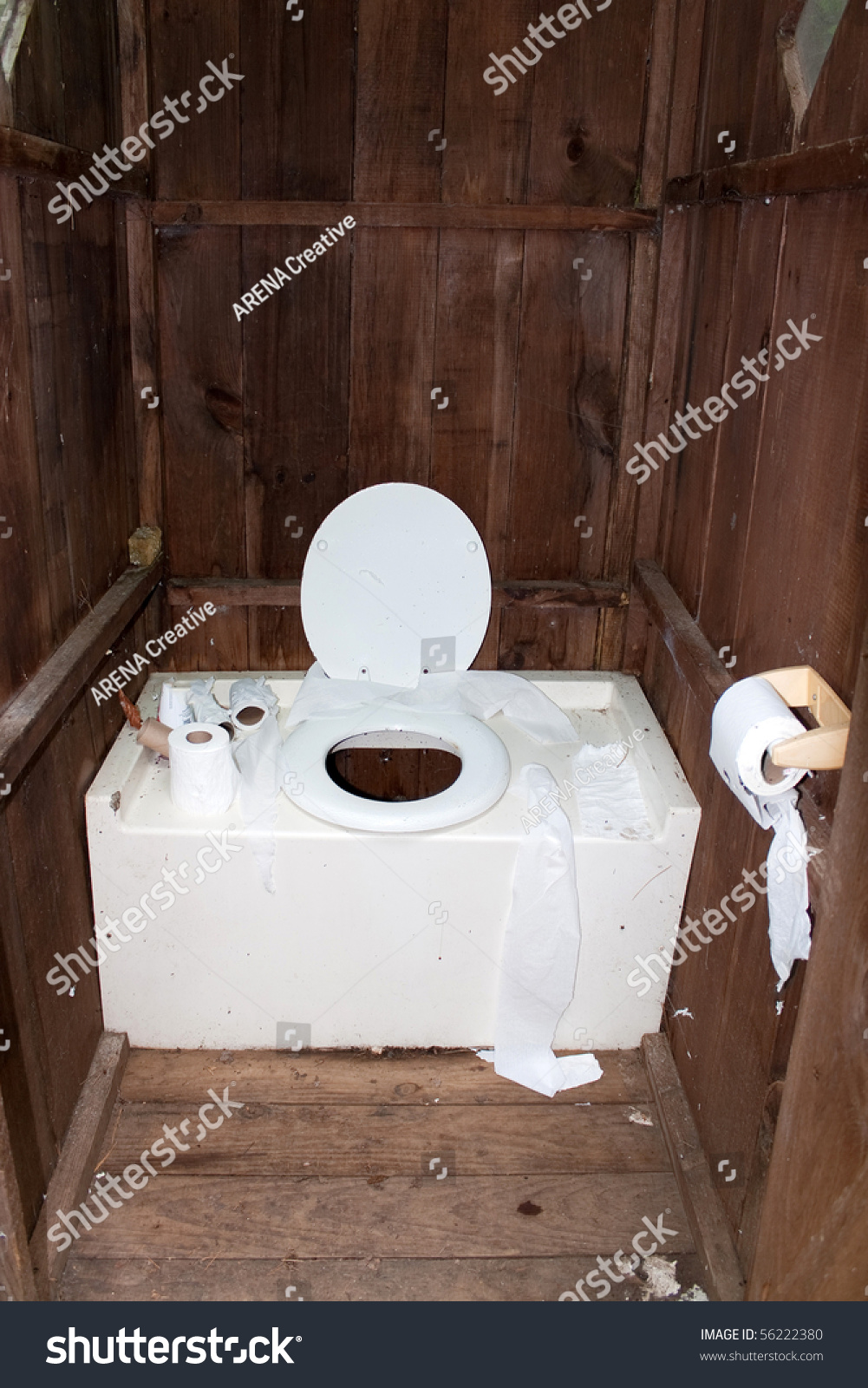 Interior Of A Dirty And Disgusting Outhouse With Toilet Paper Littered ...