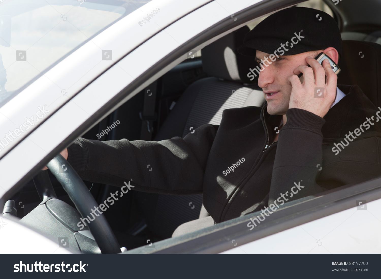 Irresponsible Man Driving And Talking On The Phone At The Same Time ...