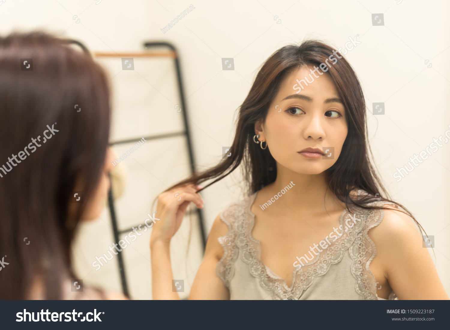 https://image.shutterstock.com/z/stock-photo-japanese-young-woman-looking-at-the-mirror-beauty-image-1509223187.jpg