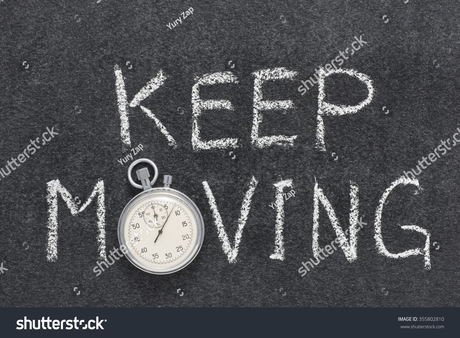 keep-moving-phrase-handwritten-on-chalkboard-stock-photo-355802810